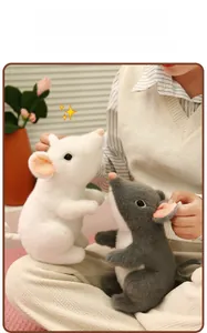 Detail of plush mouse toys with soft fluffy fabric in white and gray standing pose