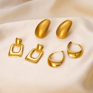 Three-pair gold stainless steel earring set featuring studs, hoops, and geometric drops