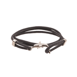Close-up of double-wrapped grey woven cord bracelet with silver dolphin charm clasp