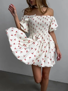 Detail of square neck puff sleeve dress with smocked bodice and red cherry prints