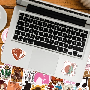 100pcs Western Cowboy stickers set on laptop featuring cactus and skull patterns