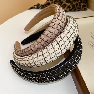 Macro shot of padded mesh headbands with sparkling rhinestones in black, beige, and nude
