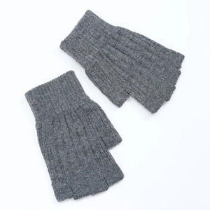 Detailed knit texture of gray fingerless gloves in a high-quality flat lay view