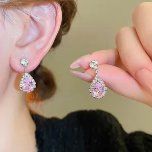 Elegant vintage style set with pear-cut pink diamond drop earrings and necklace