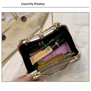 Internal capacity of glitter evening clutch bag showing makeup items and metal handle