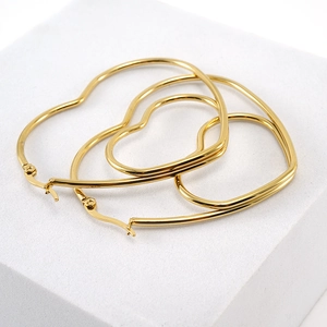 Elegant 18K gold-plated stainless steel heart-shaped hoop earrings on display stand