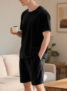Detail of men's black velvet lounge set showing soft texture on short sleeve top