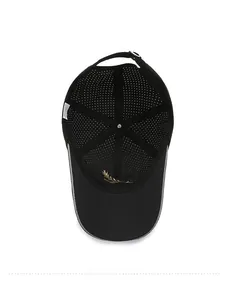 Detail view of breathable mesh lining and golden laurel embroidery inside a black baseball cap