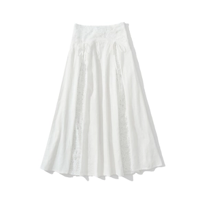 Detailed view of white maxi skirt with lace patchwork and drawstring waist detail