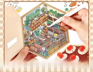 Close-up of cafe scene DIY scrapbooking stickers with tweezers and 2.5D matte cards