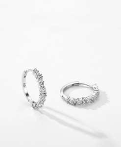 Close-up of S925 sterling silver hoop earrings with marquise-cut cubic zirconia stones