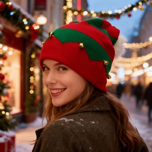 Festive Christmas knit hat with red and green zigzag patterns and small golden bells