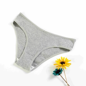 Detailed macro view of the grey ribbed cotton fabric and V-shape stitching on the briefs