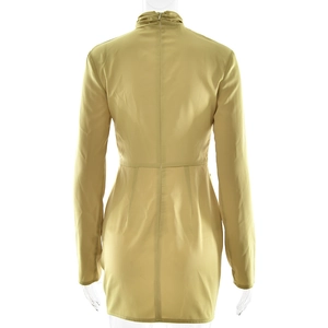 Detailed view of the invisible zipper on the back of this gold long sleeve dress