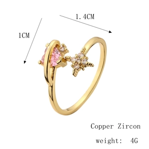 Detailed view of adjustable copper gold ring with pink heart zircon and star motif