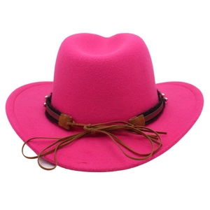 Close-up of bright magenta felt cowboy hat with brown studded decorative band and chin strap