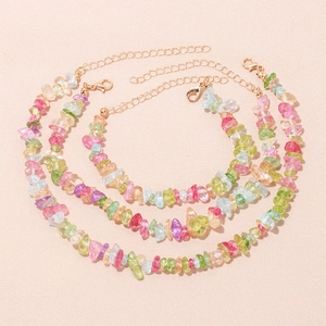 Detail of three-piece natural stone bead anklet set with golden metal chains and lobster clasp