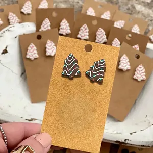 Handmade gingerbread style Christmas tree earrings with colorful dots and wavy patterns