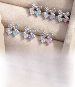 Bow heart ear studs made of titanium steel with zircon in blue and pink tones
