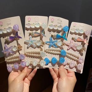 Barrettes sirène irisées avec coquillages, étoiles de mer et perles de couleurs