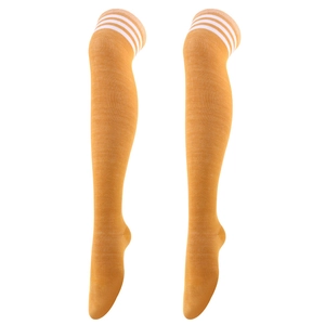 Detailed close-up of mustard yellow over-knee socks with classic white triple stripes