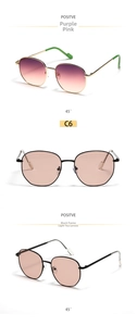 Close-up of stylish round metal sunglasses in purple pink and tea transparent lenses