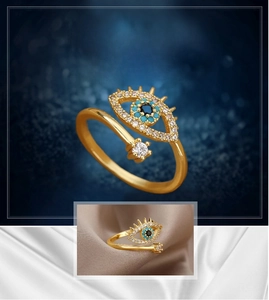 Detailed close-up of Evil Eye open ring featuring turquoise beads and gold finish