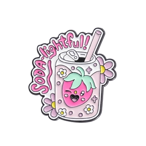 Pink cartoon soda can enamel pin featuring strawberry patterns and delightful text