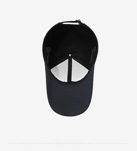 Detailed interior of a dark baseball cap showing breathable mesh and metal buckle