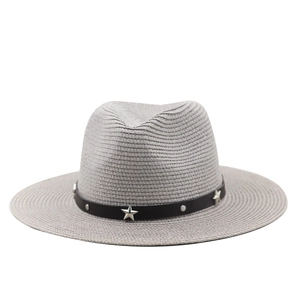 Detail of grey straw hat featuring black leather band and silver star studs