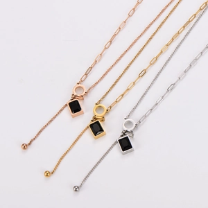 Elegant gold, rose gold and silver layered necklaces with black acrylic charms and beads