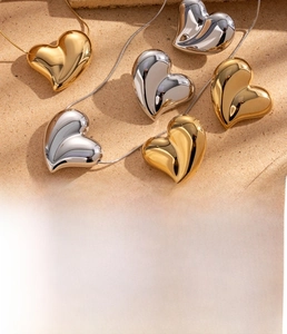 Polished titanium steel heart pendants in gold and silver finish with vacuum plating texture
