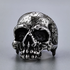 Retro punk style stainless steel skull ring with distressed silver finish and gothic details