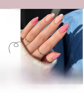 Detail view of pink oval press-on nails with delicate floral patterns and glossy finish