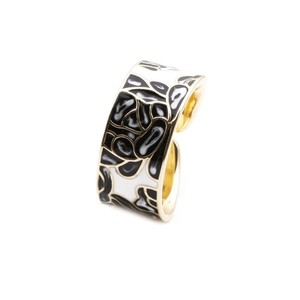 Gold-plated wide open ring with colorful enamel floral patterns on white background