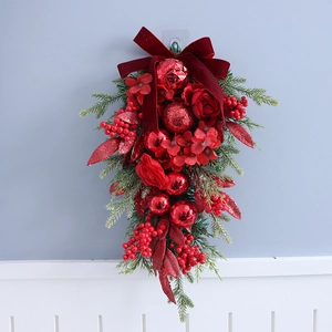 Christmas upside down tree swag with red bow berries and pine needles for door decor