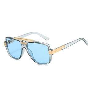 Retro square sunglasses with light blue lenses and gold metal accents on transparent frames