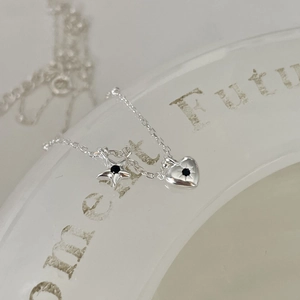 925 sterling silver necklace featuring star and heart charms with black stones
