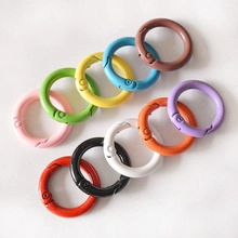 Macro view of colorful alloy spring ring buckles for DIY bags and keychains in ten colors