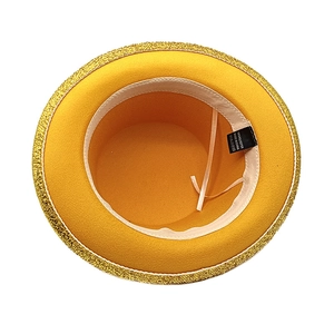 Detail view of yellow felt top hat interior showing 100% polyester label and sequins