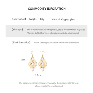 Detailed view of vintage gold-plated leaf earrings with glass droplets and measurements