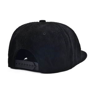 Rear view of black corduroy flat brim snapback hat with adjustable plastic strap