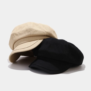 Classic corduroy newsboy cap for women in black and beige, retro octagonal hat style