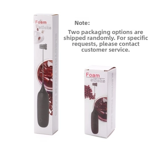 Detail view of electric milk frother with black handle and retail packaging boxes