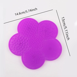 Macro detail of purple flower silicone brush cleaner pad with five textured patterns