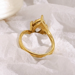 Macro view of 18K gold plated ring featuring a large pear-cut cubic zirconia stone