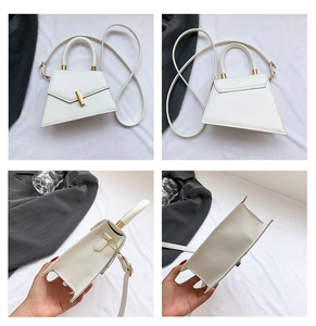 Detailed views of a white trapezoid leather handbag with gold hardware from multiple angles