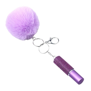 Purple faux fur pompom keychain with a sparkling rhinestone perfume bottle charm