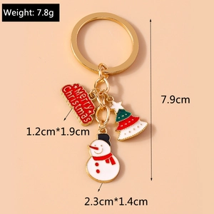 Detail showing Christmas tree and snowman keychain charms with Merry Christmas tag