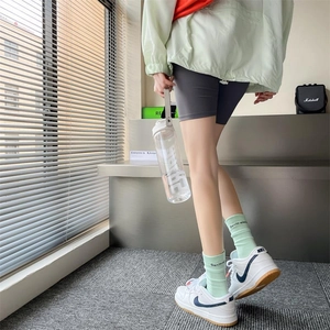 Light green cotton mid-calf sports socks with Suxin lettering and athletic ribbed cuffs